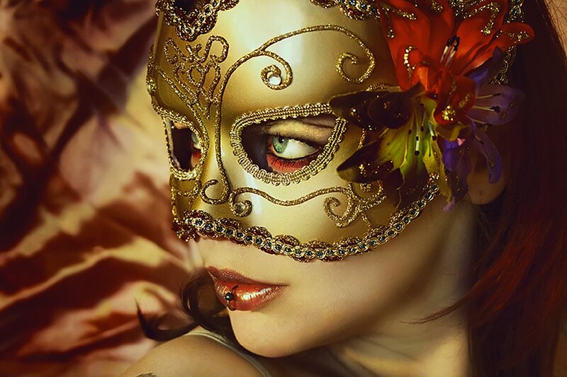 woman in ornate mask