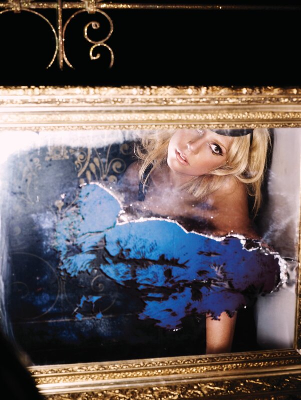 woman in ornate mirror