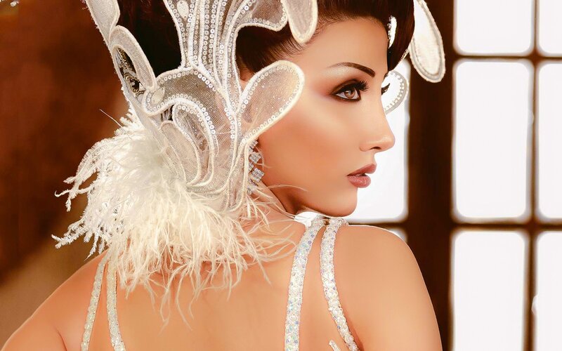 woman in ornate white headpiece