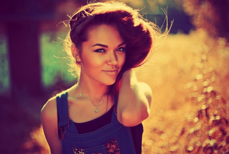 woman in overalls outdoors