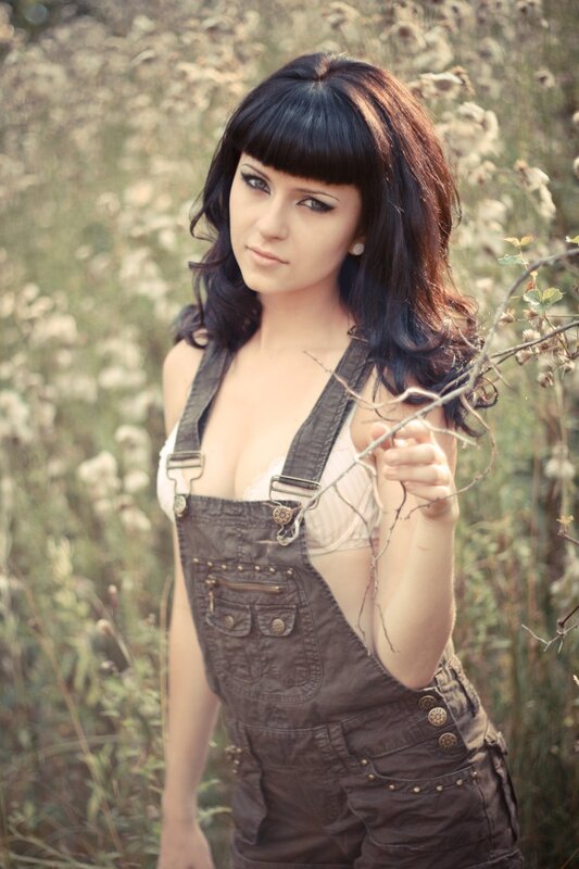 woman in overalls outdoors