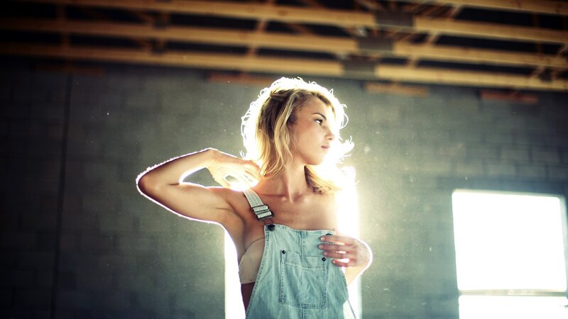 woman in overalls with sunlight