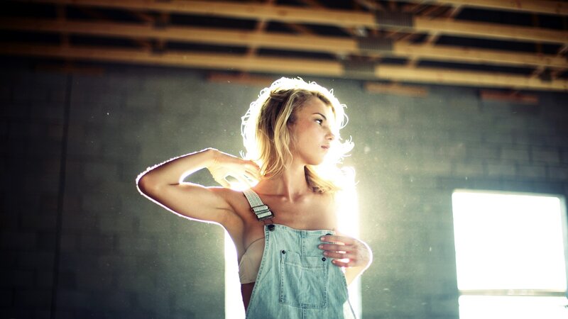 woman in overalls with sunlight