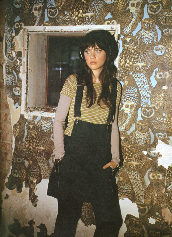 woman in owl wallpaper room