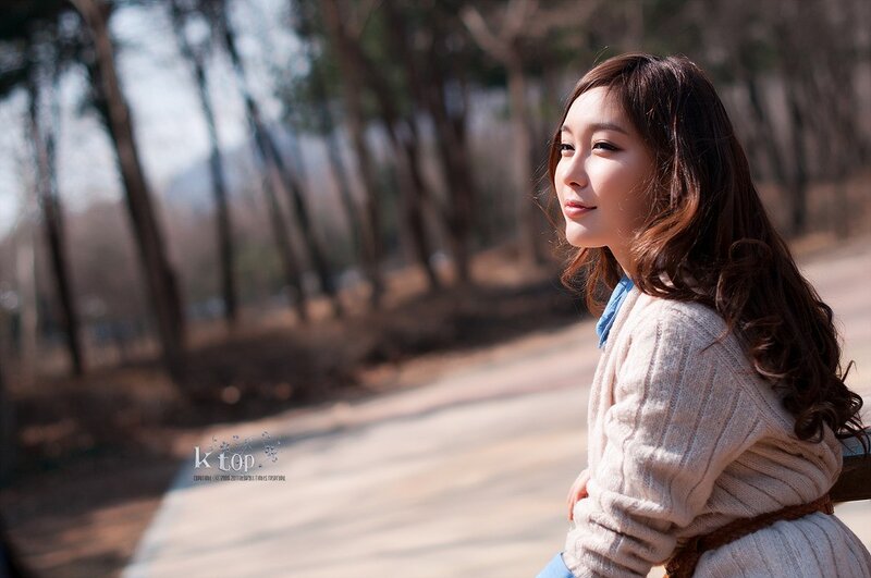 woman in park at sunset