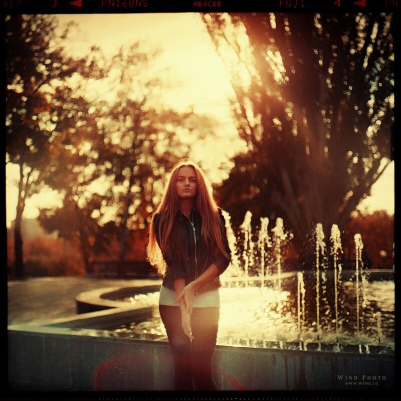 woman in park at sunset