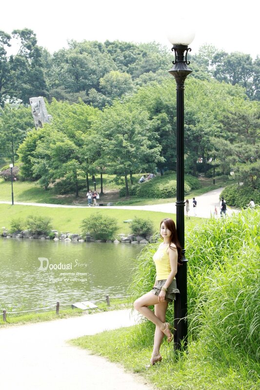 Woman in park by lake
