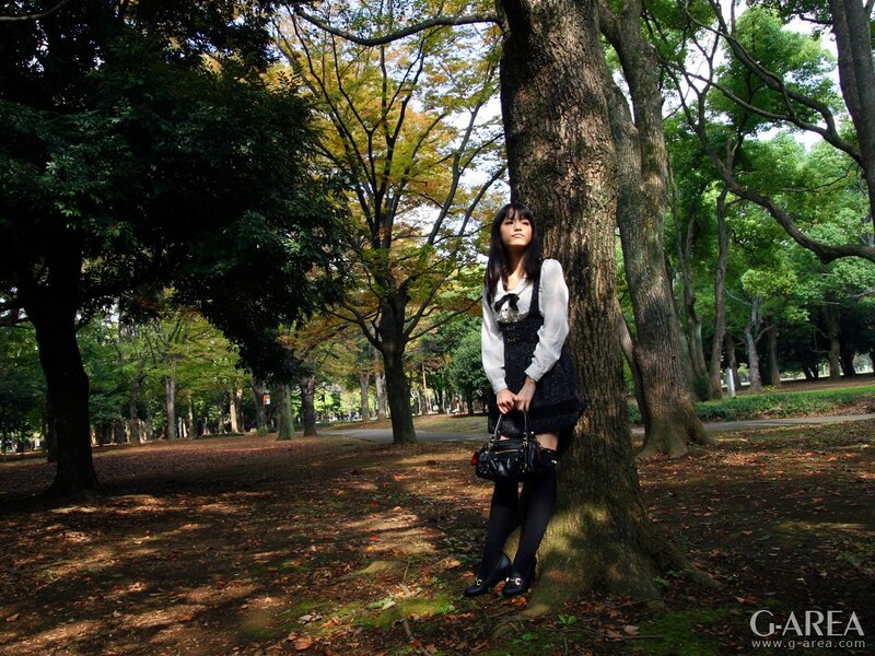 Woman in park near tree