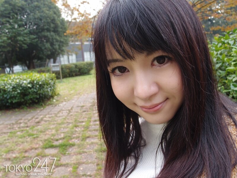 woman in park smiling