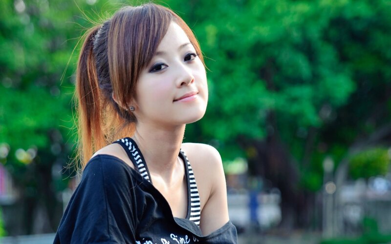 woman in park smiling