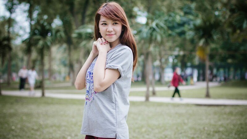 woman in park smiling