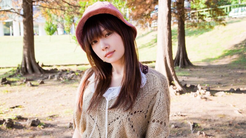 woman in park wearing hat