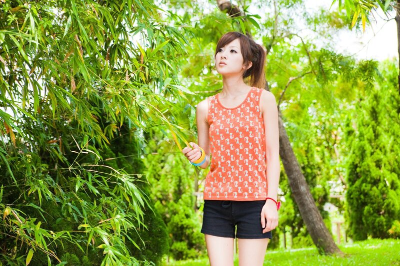 Woman in park with bamboo