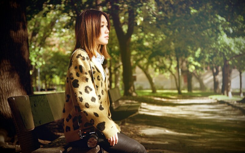 Woman in park with camera