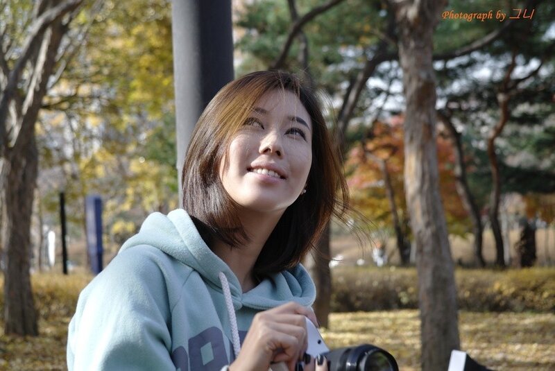 woman in park with camera