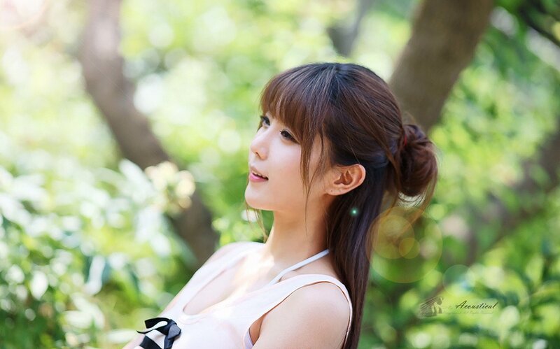 woman in park with green background