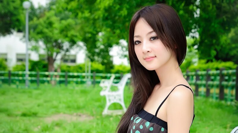woman in park with green background