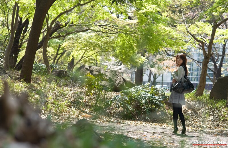 Woman in park with handbag