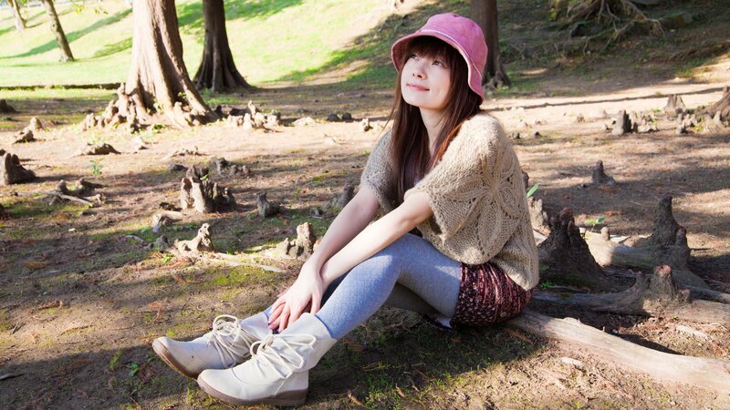 Woman in park with pink hat