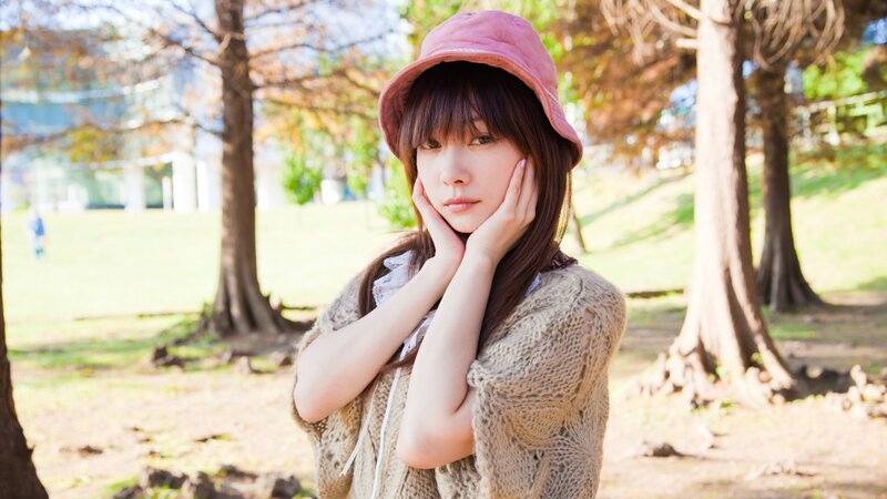 woman in park with pink hat