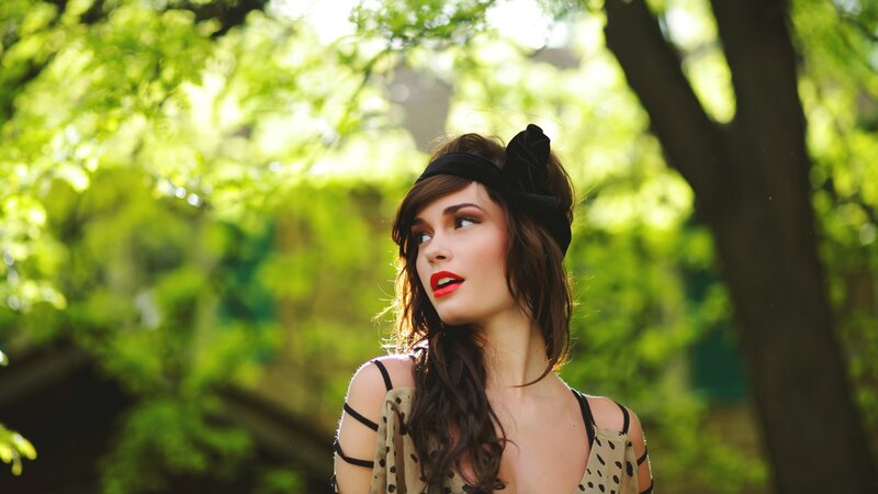 woman in park with red lipstick