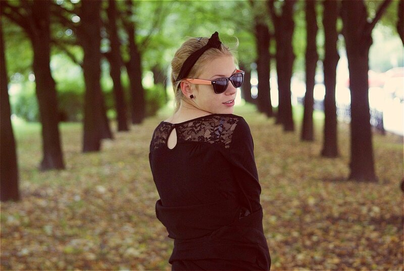 woman in park with sunglasses