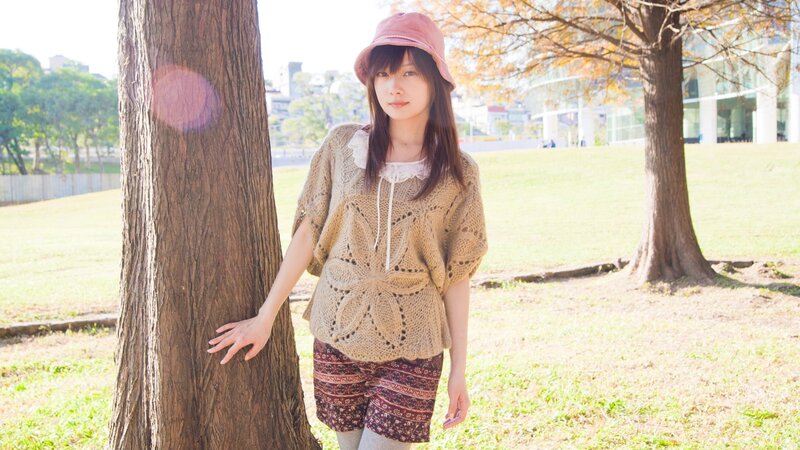 woman in park with tree