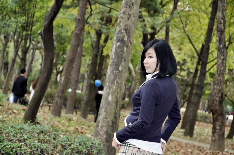 woman in park with trees