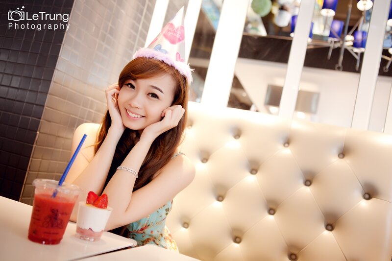 Woman in party hat at cafe