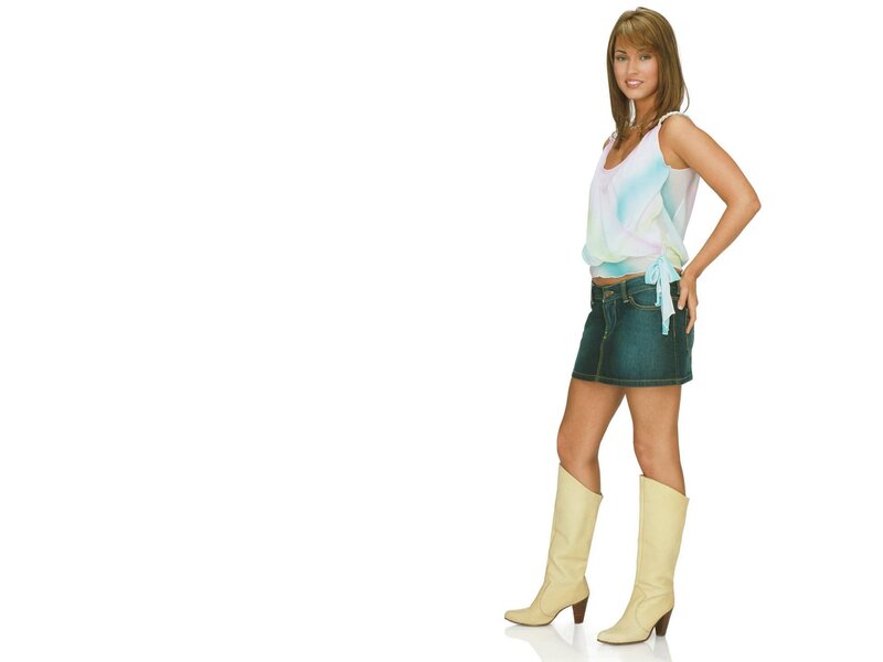 woman in pastel top and boots
