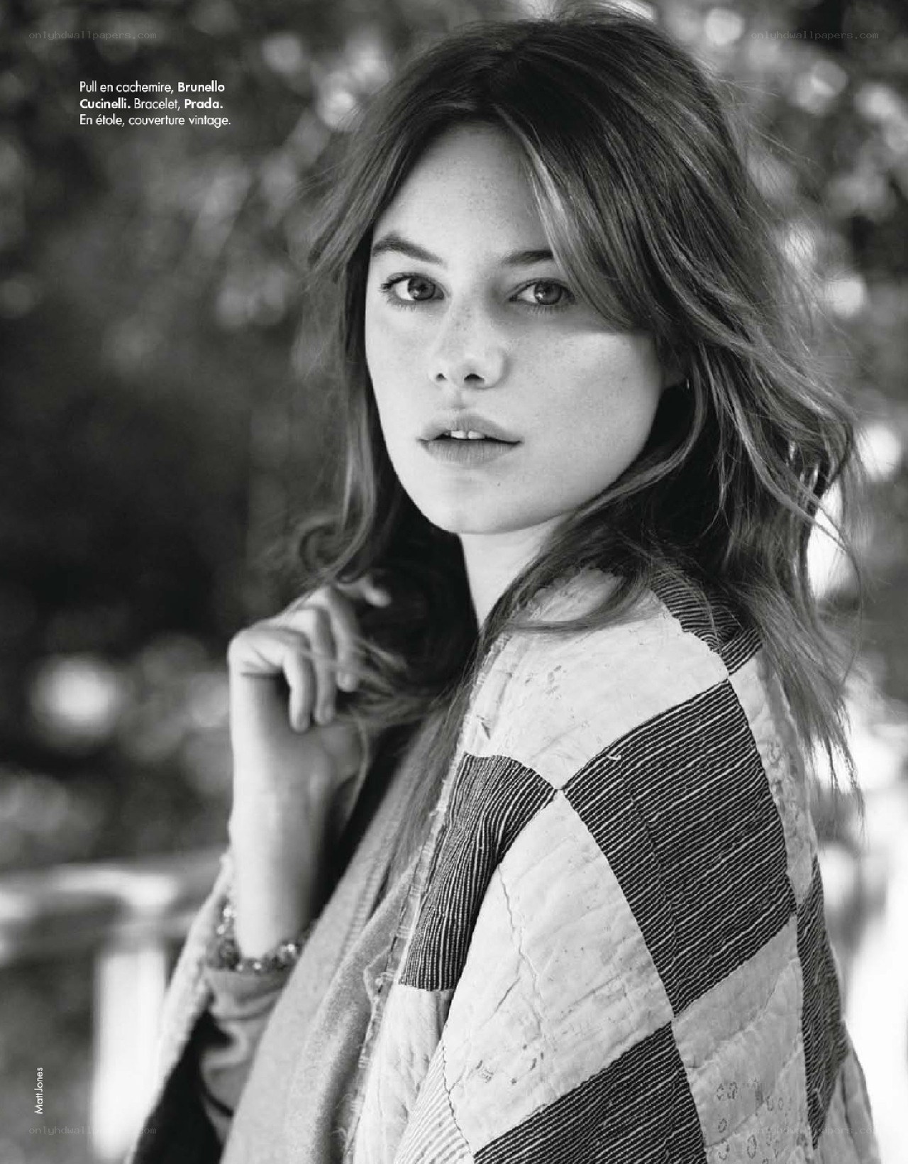 Woman in patchwork jacket