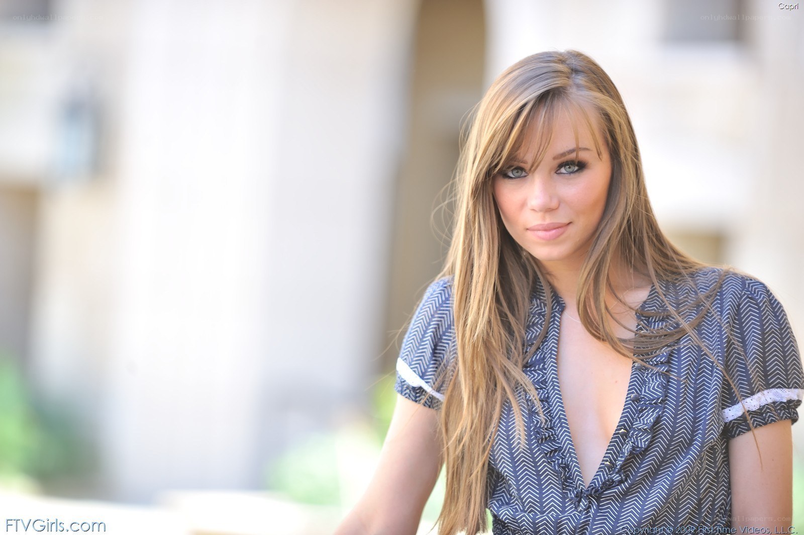woman in patterned blouse