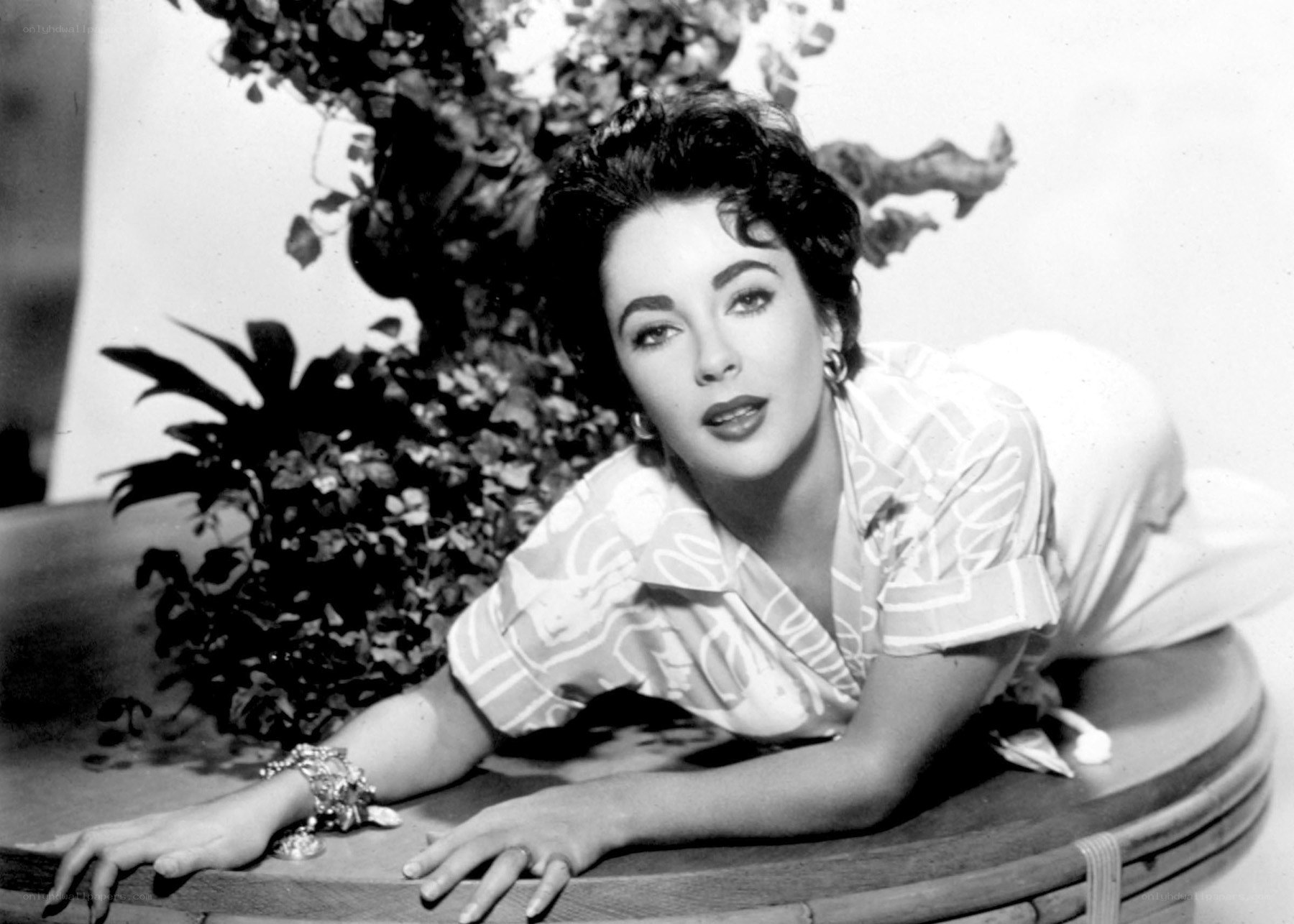 woman in patterned blouse