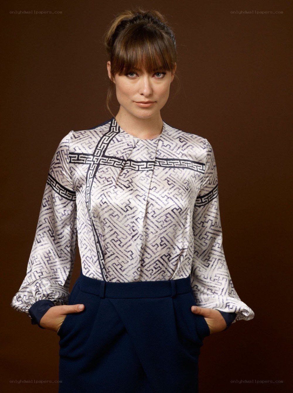 woman in patterned blouse