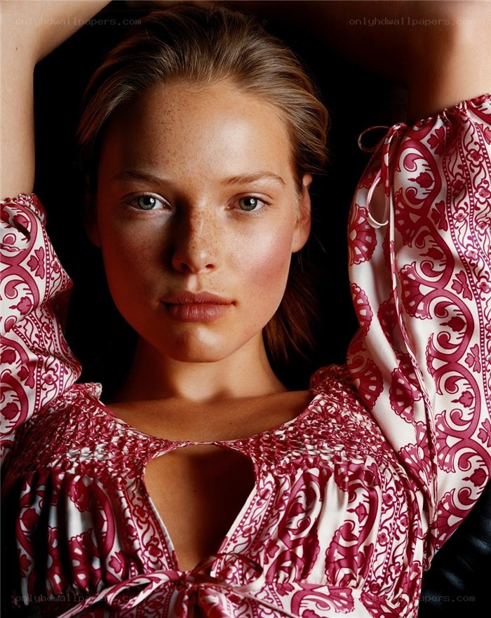 woman in patterned blouse