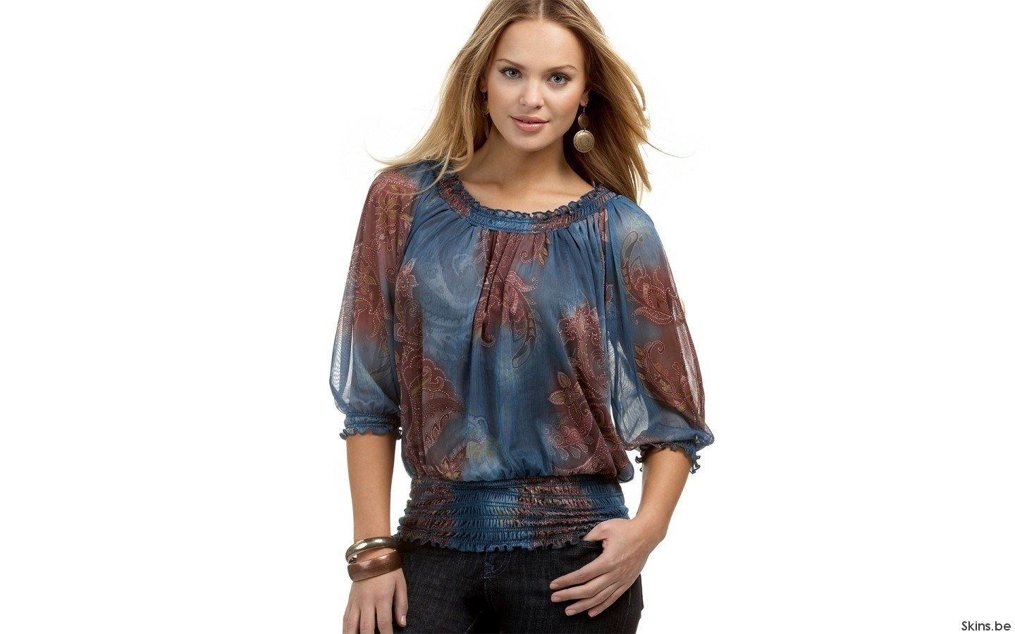 woman in patterned blouse