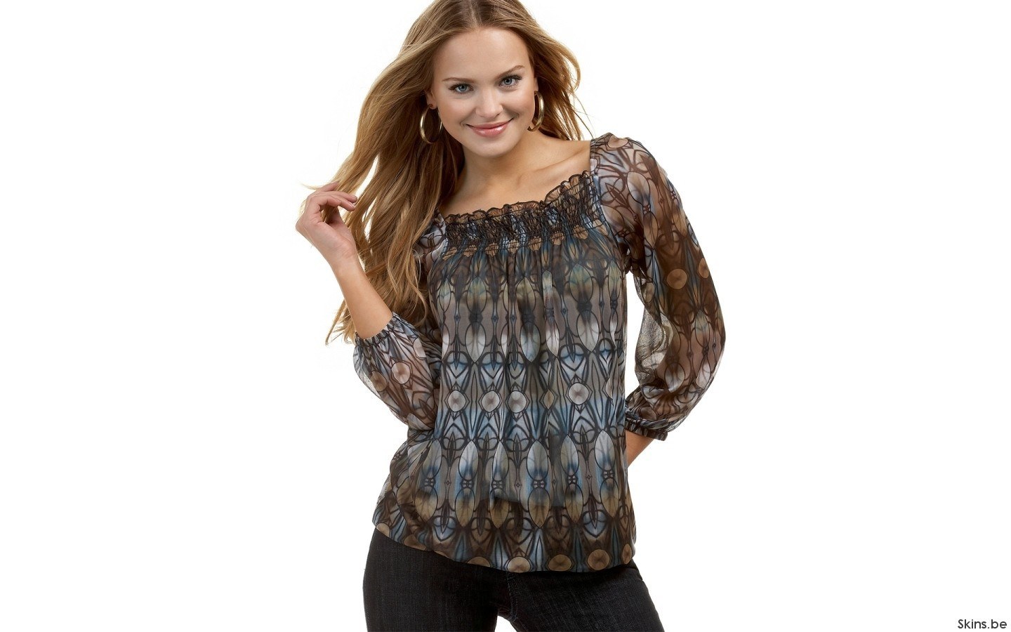 woman in patterned blouse