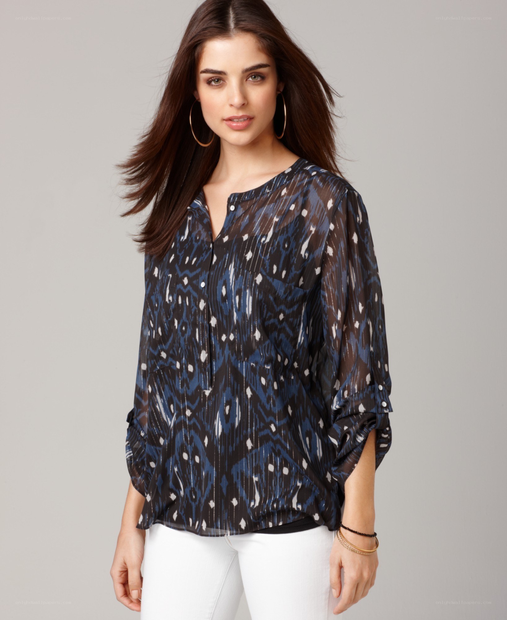 woman in patterned blouse