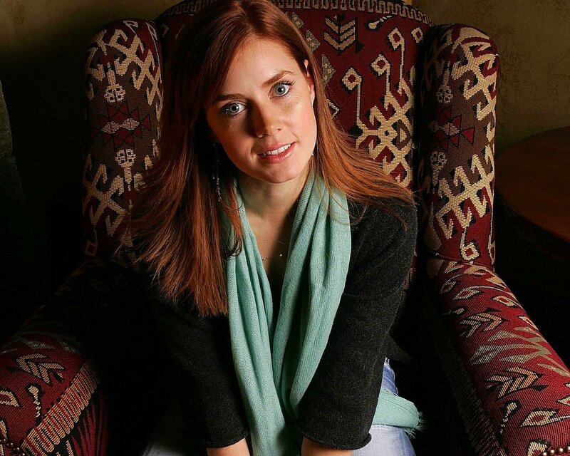 woman in patterned chair