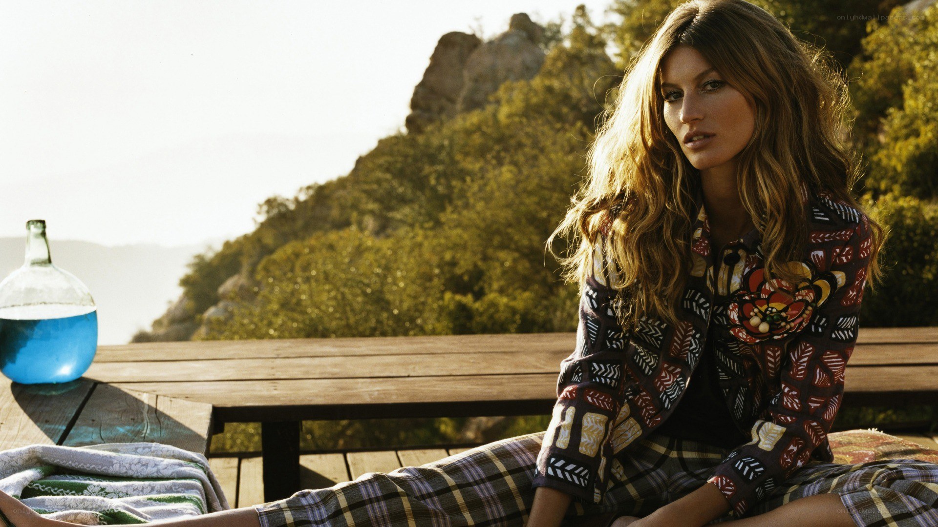 Woman in patterned clothes on deck