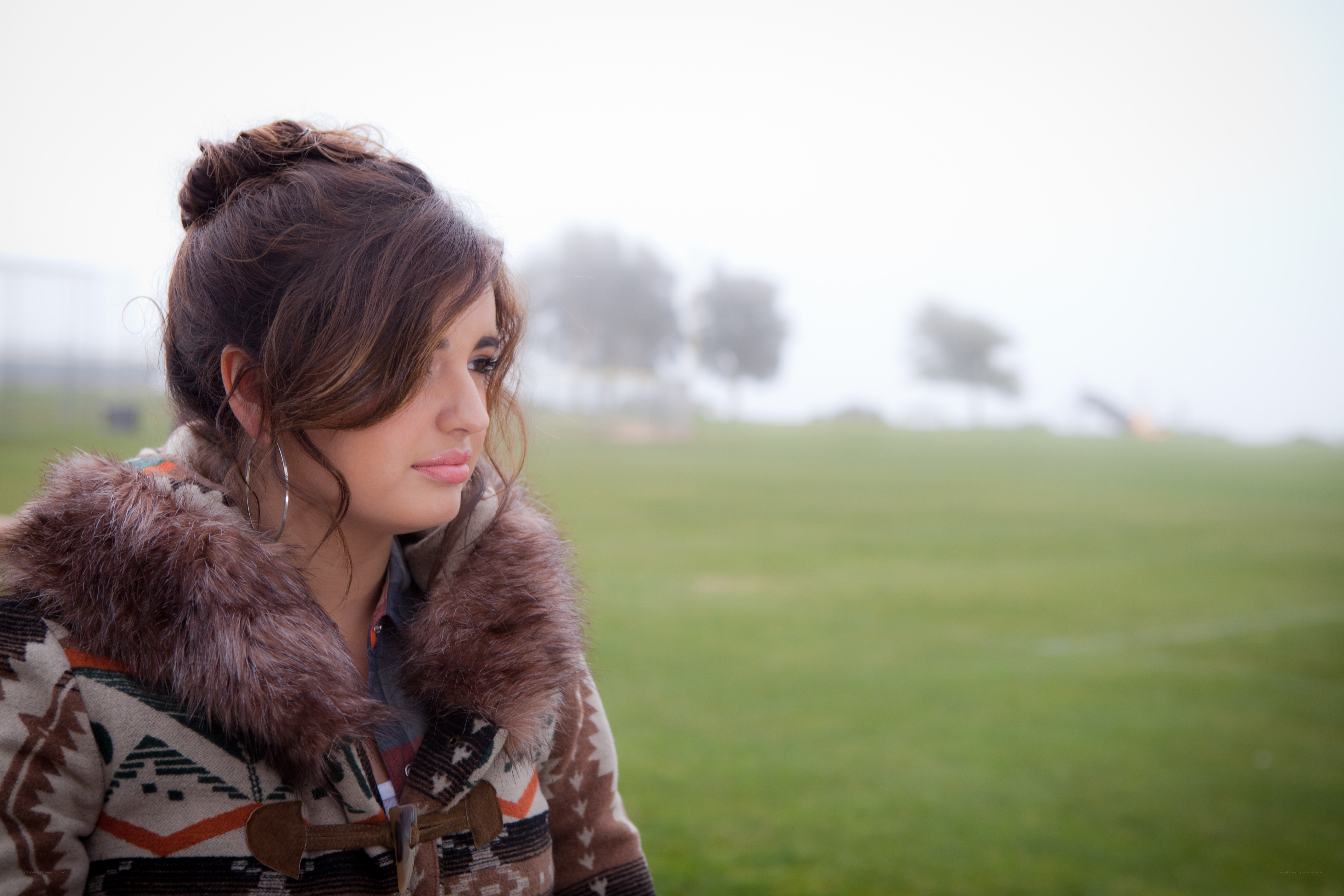 woman in patterned coat