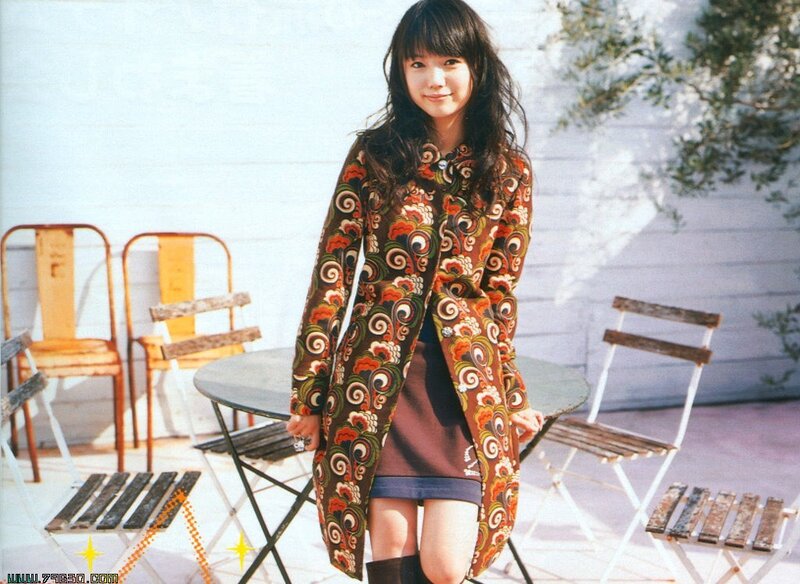 Woman in patterned coat outdoors