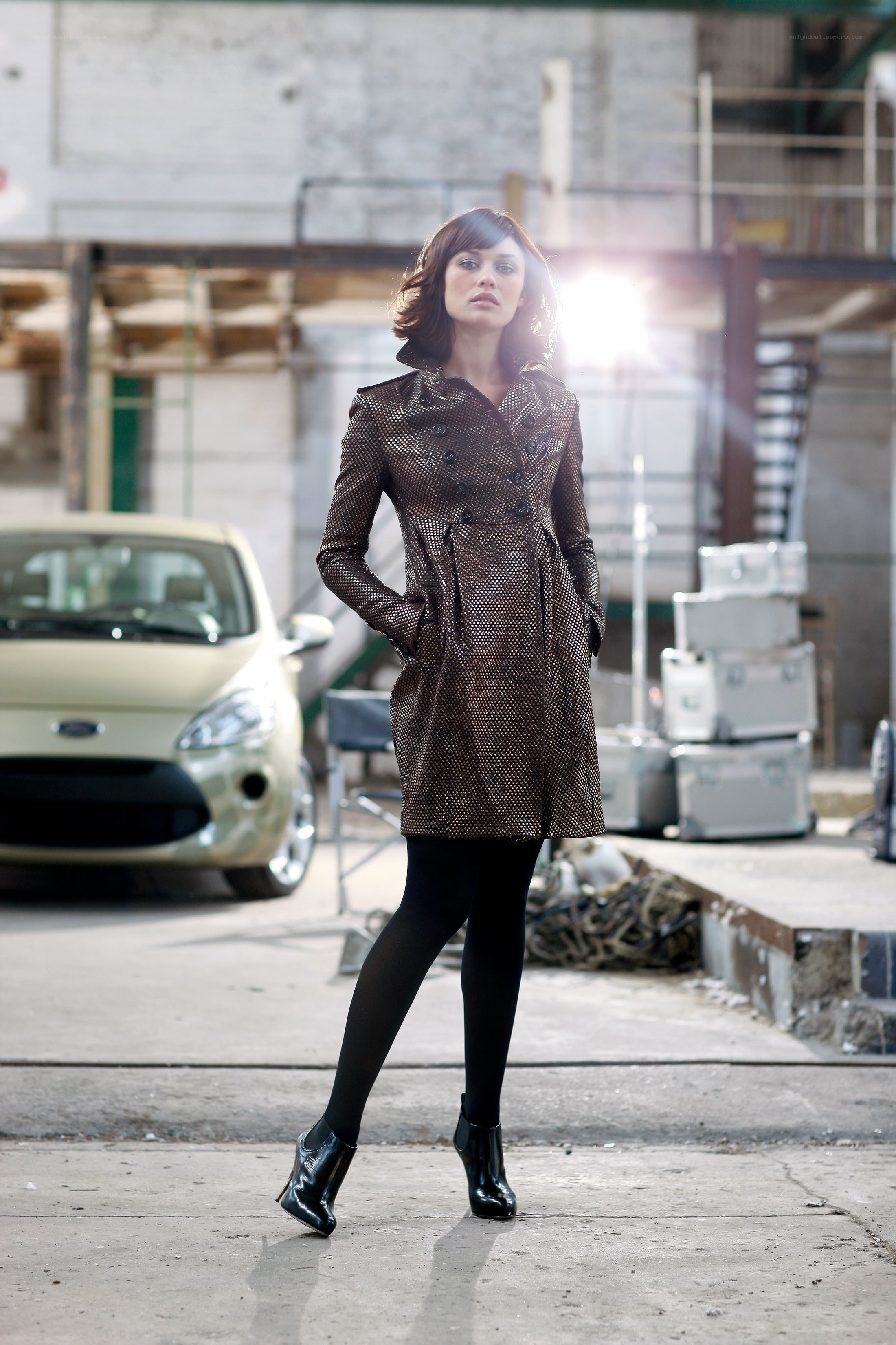 Woman in patterned coat standing