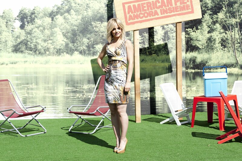 Woman in patterned dress at lakeside