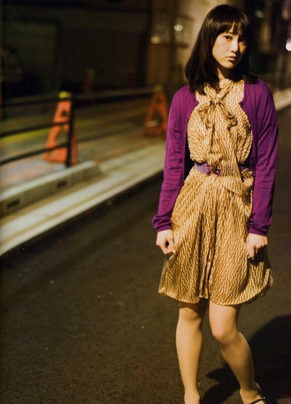 woman in patterned dress at night