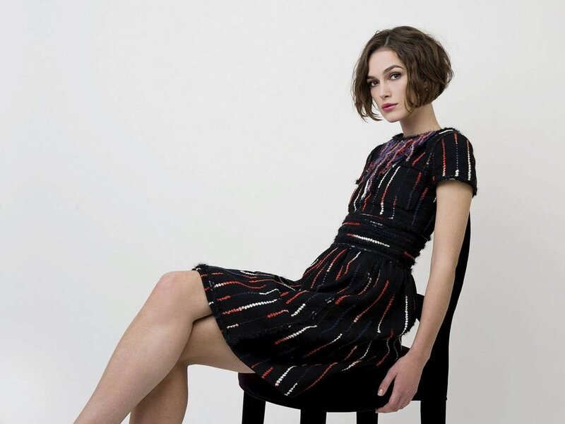 Woman in Patterned Dress — Black, Neutral, Photograph, Chair