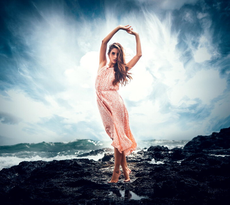 Woman in Patterned Dress — Blue, Dramatic, Photograph, Rocks