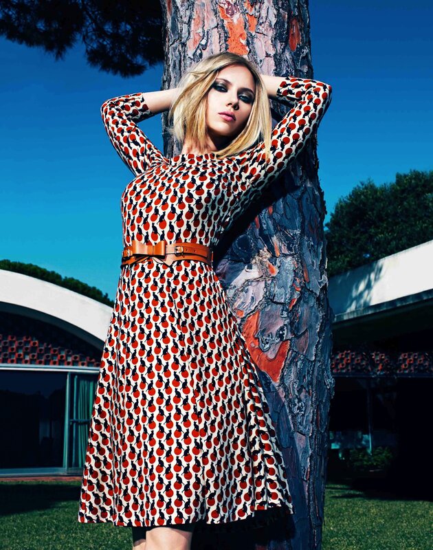 woman in patterned dress by tree