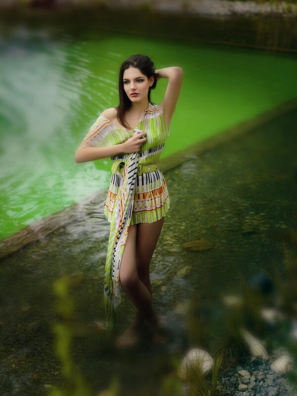 woman in patterned dress by water