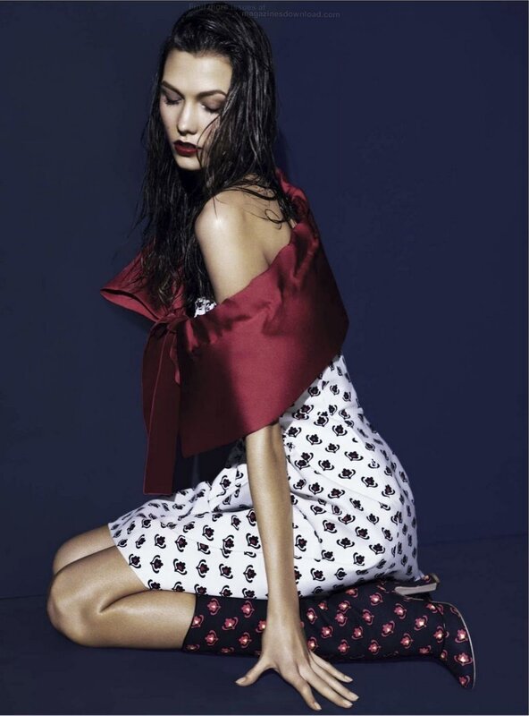 woman in patterned dress kneeling